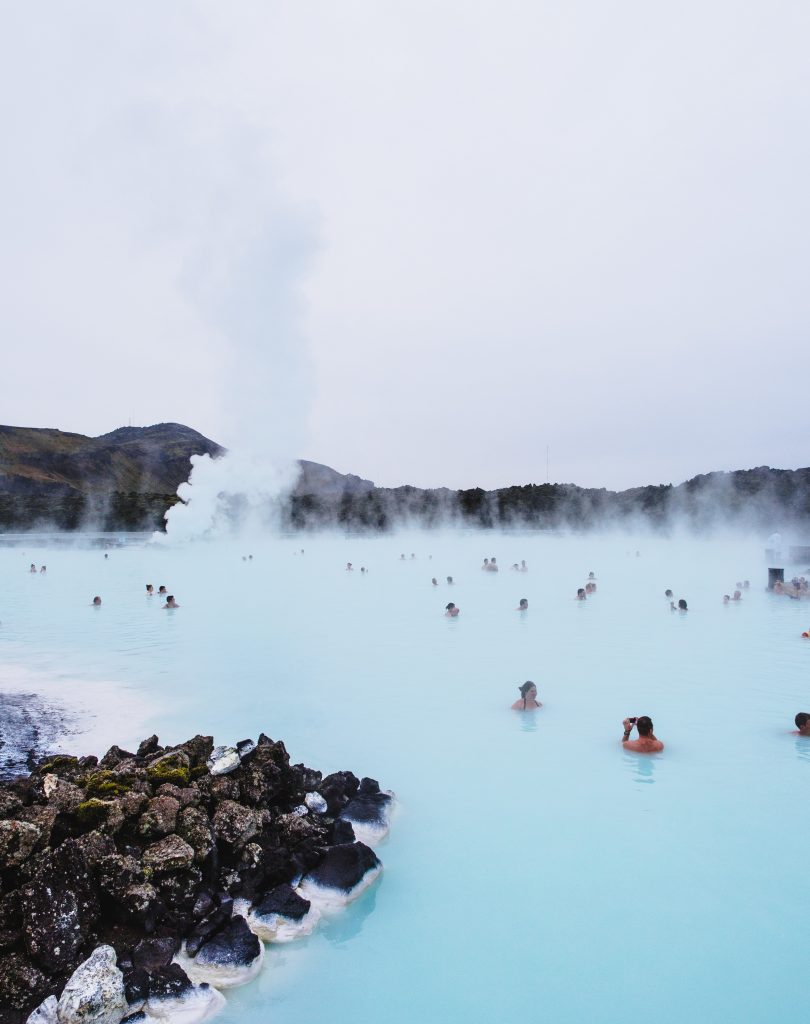 a family swimming in the Blue Lagoon in Iceland