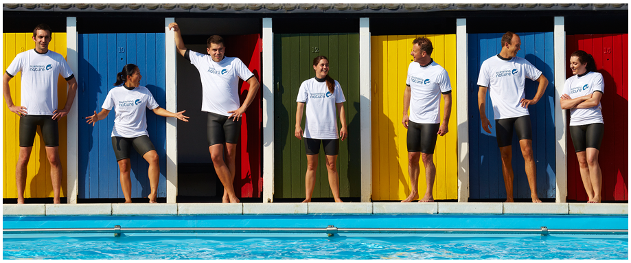 Swimming instructors standing in a line at Tooting Bec lido